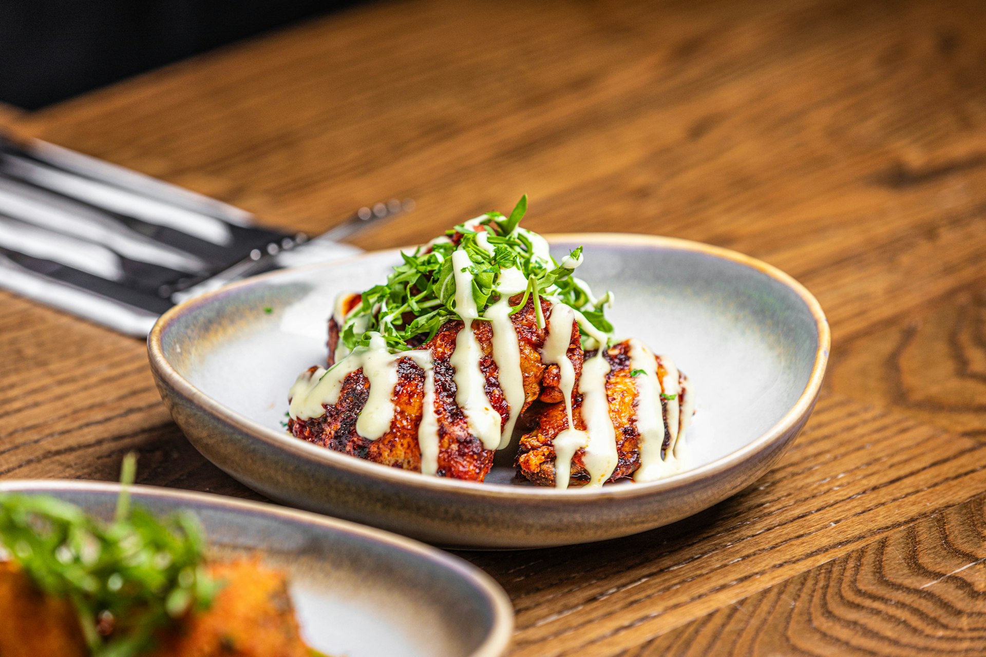a plate of food on a wooden table